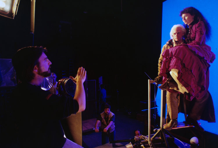 Christopher Lloyd and Mary Steenburgen shooting a scene on blue screen.