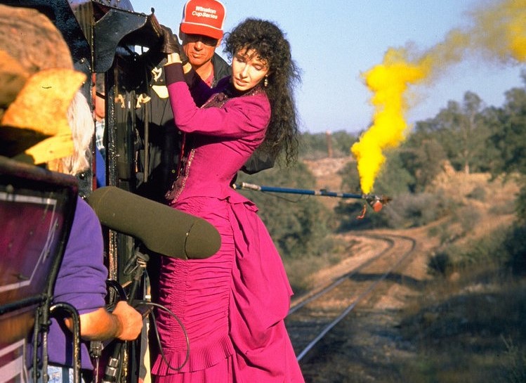 Mary Steenburgen preps for a scene where she hangs onto the side of the train moving at high speed.