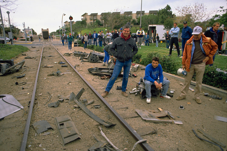 The crew surveys the damage done to the DeLorean.